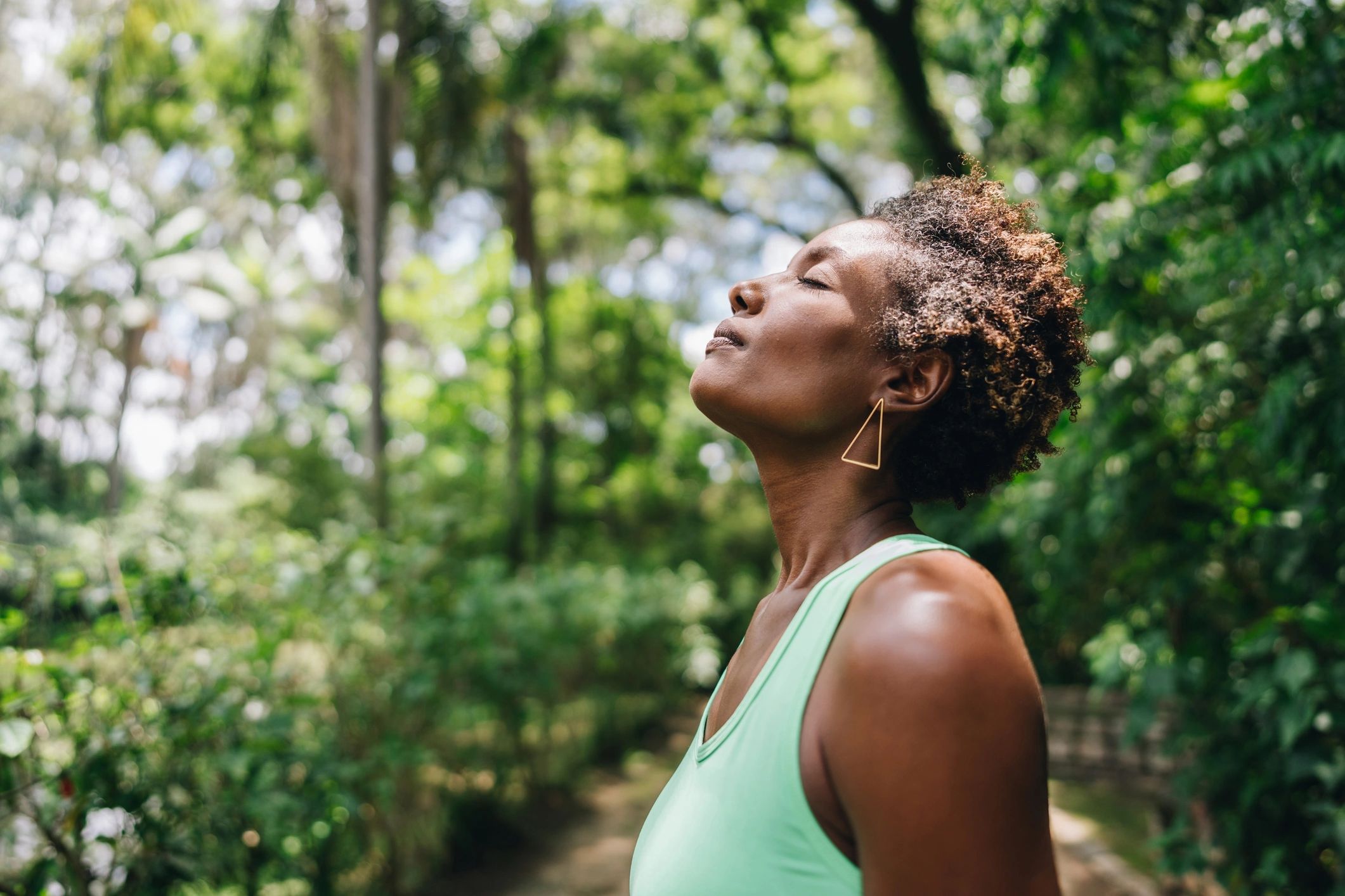 Mature woman sitting calmly in a park