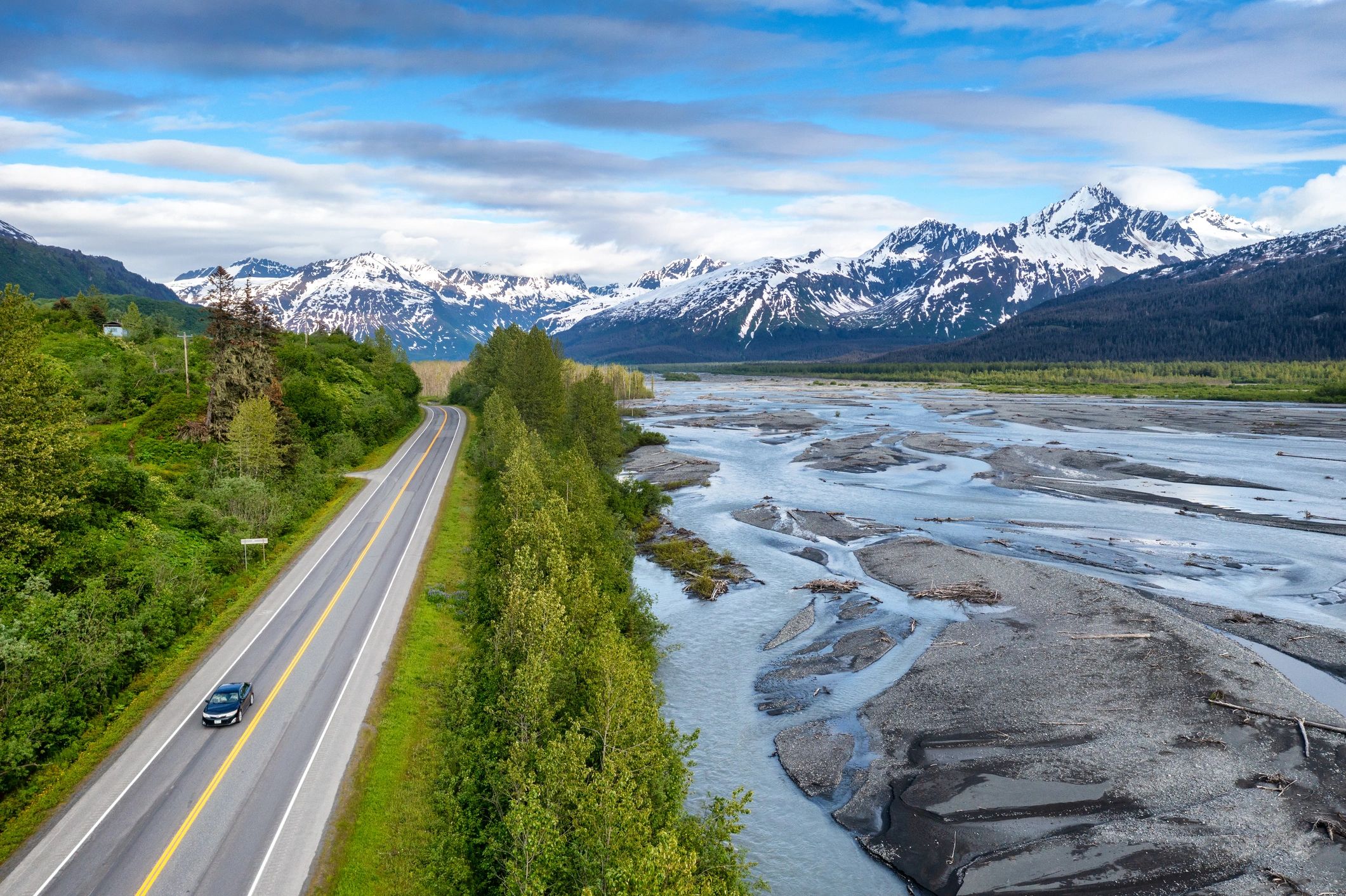 Aerial view of a road through Alaska mountains